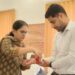 डीएम किशनगंज नवीन कुमार को राखी बांधती एक बहन…
